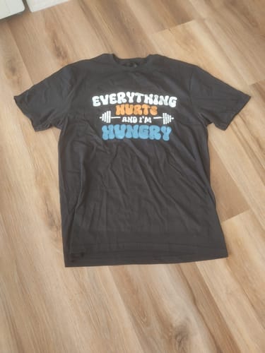 Customer photo review of EVERYTHING HURTS T-SHIRT