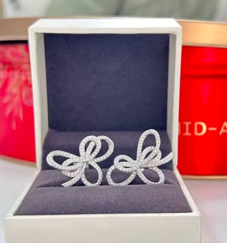 Customer photo review of Graffy Bow Knot Moissanite Stud Earrings 14K White Gold Plated Silver
