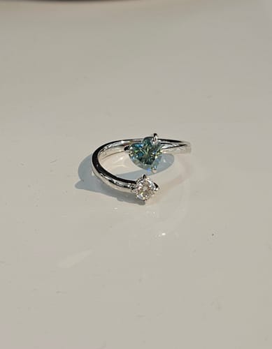 Customer photo review of Doveggs Marquise Modified H&A cut pave colored moissanite engagement ring