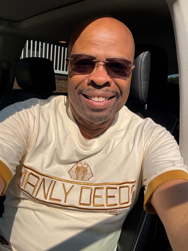 Customer photo review of Alpha Phi Alpha "MANLY DEEDS" Embroidered Tee Cream