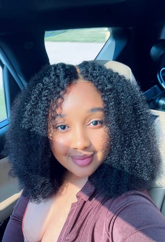 Customer photo review of CurlyMe Pre-bleached Wear Go Glueless Afro Kinky Curly Pre-cut HD Lace Wig Pre-plucked