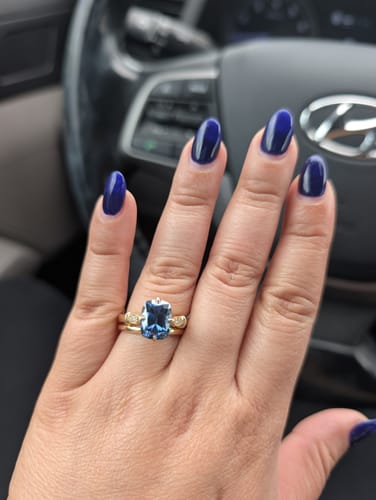 Carolina A. review of Twilight Dreams cushion side stones twilight blue moissanite engagement ring image 1 out of 1