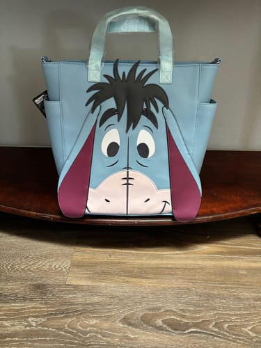 Customer photo review of Loungefly Disney Winnie the Pooh Eeyore Convertible Tote Bag