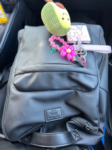 Reseña con foto de un cliente sobre Mochila Notebook Charm