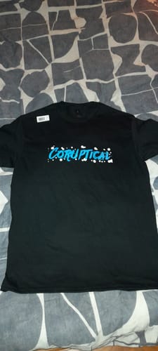 Reviewer's black unisex t-shirt showing the custom 'Coruptical' graphic in blue and white.
