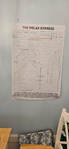 Customer's Polar Express giant word search puzzle hanging on a wall, partially completed.