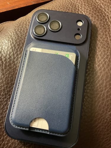 Reviewer's blue MagCase Metal on an iPhone with a matching magnetic MagWallet attached to the back.