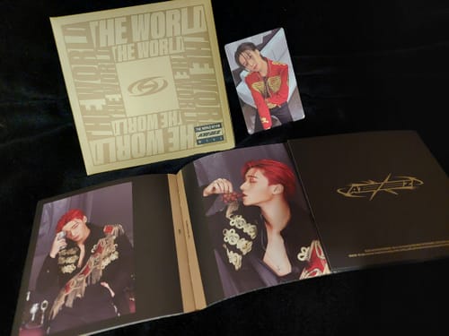Customer's ATEEZ THE WORLD EP.FIN : WILL Digipak album is displayed open with the photobook and a matching photocard.