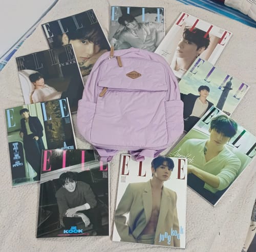 Customer's ELLE Magazine cover set featuring Jung Kook, with nine different issues fanned out on a surface.