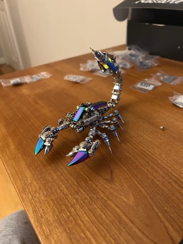 Customer's assembled Rage Scorpion model with iridescent details on a wooden table.