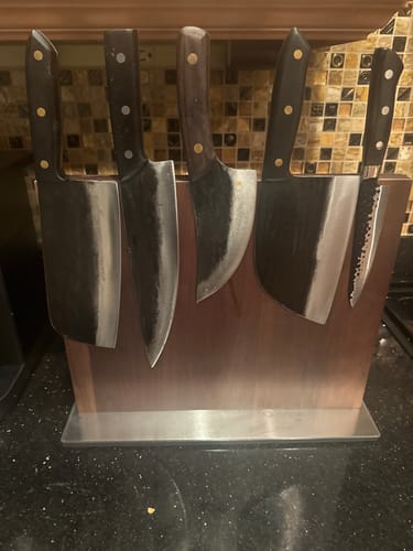 Customer's collection of five different Mystery Knives displayed on a wooden magnetic knife block.