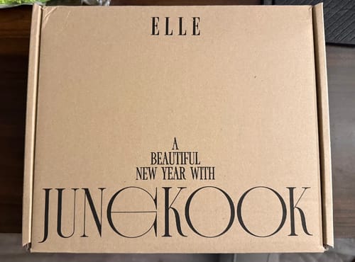 Customer's shipping box for the ELLE Magazine cover set, printed with 'A BEAUTIFUL NEW YEAR WITH JUNGKOOK'.