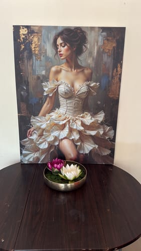 Reviewer's Female Portrait 334 canvas print displayed on a dark table with a decorative bowl in front.