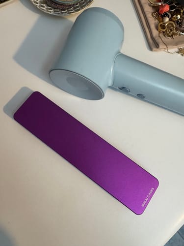 Customer's sleek, purple Weekly Case shown closed on a white tabletop.