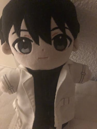 A customer's close-up of the Omniscient Reader's Viewpoint stuffed doll, showing its black hair and white open jacket.