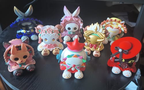 Customer's collection of eight different Emma Secret Forest Masked Masquerade figures arranged on a dark tabletop.