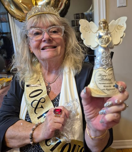 Reviewer's close-up of her smiling face, showing her skin after using the Seranova Micro Infusion System.