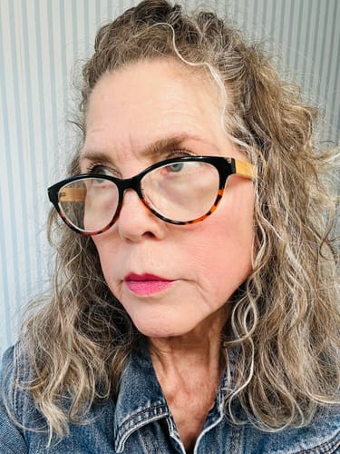 Reviewer provides a close-up of her stylish Lucia Readers, showing the black and tortoise shell cat-eye frames.