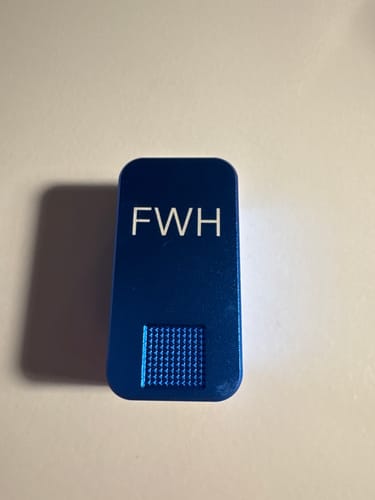 Reviewer's blue, personalized Nano Case showing the initials 'FWH'