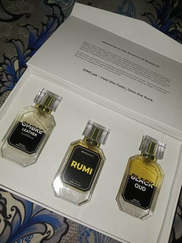 Customer's OUD Supreme BUNDLE showing three fragrance bottles displayed in an elegant white gift box.