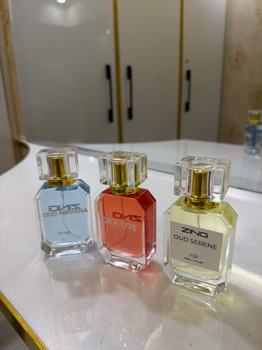 Customer's OUD Supreme BUNDLE perfumes: Oud Nirvana, Ora 1776, and Oud Serene displayed on a bathroom vanity.