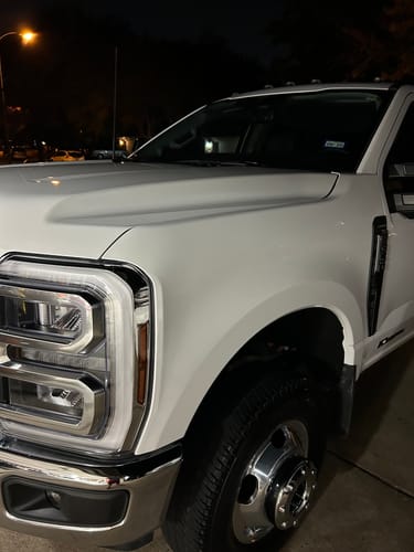 Customer's white truck at night with a very shiny finish after using the BLACKLINEĀ® SYNTHETIC CLAY TOWEL.