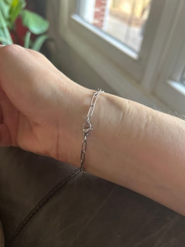 Customer wearing the dainty Maui Paperclip Bracelet on their wrist.