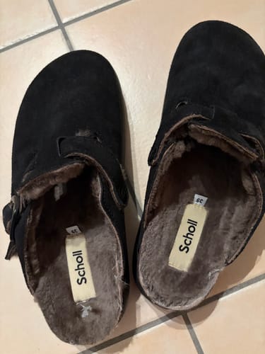 Customer's black suede FAE FUR CHUNKY mules, showing the cozy fur-lined interior from a top-down view.
