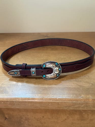 Customer's brown leather Ranger belt shown with their ornate, silver and turquoise family heirloom buckle.
