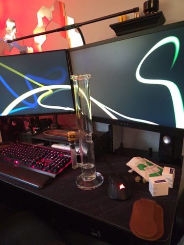 Customer's clear XL Straight Tube Water Pipe sitting on a desk in front of two computer monitors.