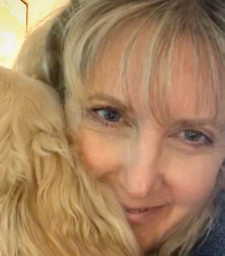 Close-up of a smiling reviewer showing clear, radiant skin after using the Tallow & Honey Balm.