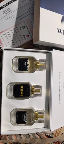 Customer's OUD Supreme BUNDLE of three perfumes—Black Oud, Rumi, and Ombre Leather—arranged in a white presentation box.