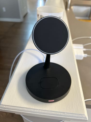 Reviewer's black MagStation Duo charger set up on a white counter, plugged in and ready to use.