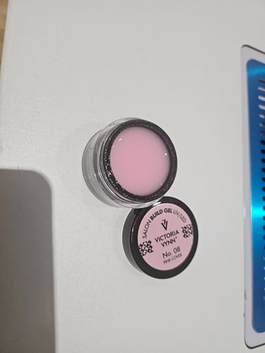 Customer's open pot of Victoria Vynn Builder Gel, showing the smooth, light pink 'Cover Pink 08' gel inside.