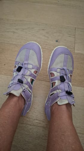 Customer wearing the light purple Breeze III Barefoot Shoes, showing the mesh design and open sides.