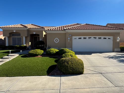 Customer's tan single-story house looking new after being painted with Golden West DET 488.