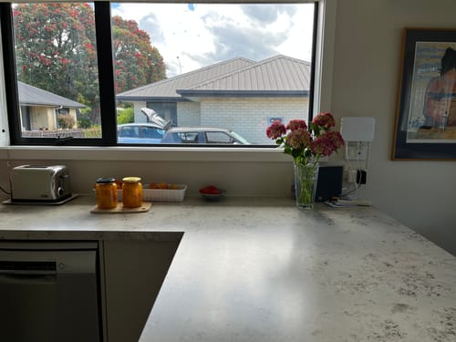 Customer's sparkling clean kitchen window after using the Dazz Eco Spray Collection.