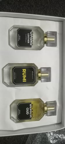 Reviewer's open Winter Box displaying the three included perfumes: Ombre Leather, Rumi, and Black Oud.