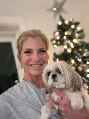 Customer smiles to show smoother smile lines after using the Seranova Micro Infusion System.