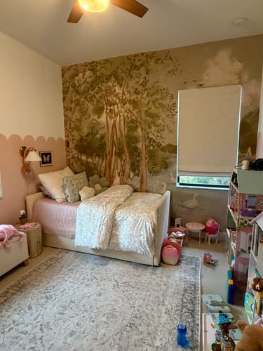 Customer's image of the Nils Wallpaper creating a beautiful woodland accent wall in a child's bedroom.