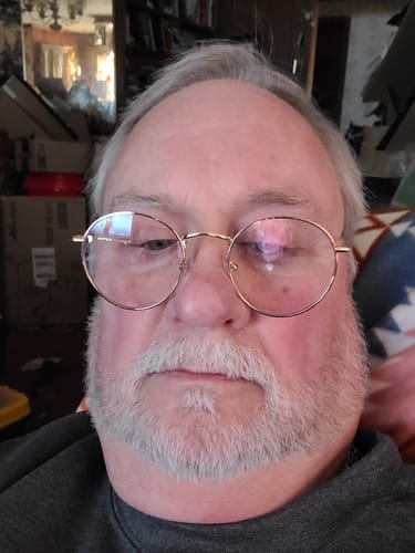 A close-up portrait of the customer reviewing Meraki Blu USP Grade Methylene Blue.