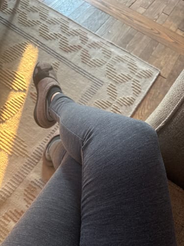 Reviewer's view of their legs in the grey Piper Pocket Petite leggings, showing a smooth, comfortable fit.