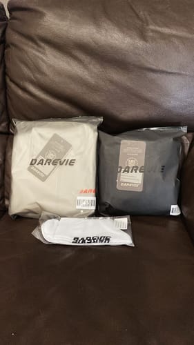 Customer's cycling apparel order as received, showing two items in packaging and a pair of socks.