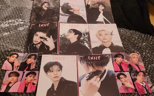 Customer's full set of STRAY KIDS DO IT SKZ IT TAPE ALBUM accordion versions and included photocards displayed together.