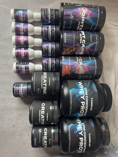 Customer's large collection of Complex supplements, featuring two tubs of Complex CFM Whey Protein laid out.