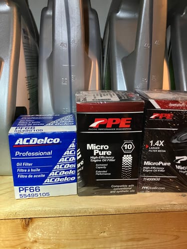Customer's PPE High-Efficiency Oil Filter box shown next to a stock ACDelco filter for a size comparison.