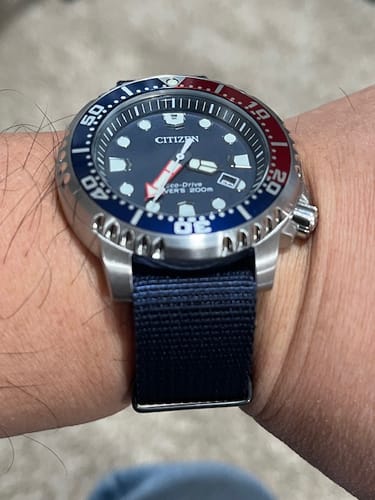 Reviewer's thick Orca - Midnight Blue strap shown on a Citizen Promaster dive watch.