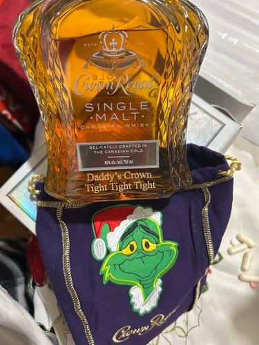 Customer's engraved Crown Royal Single Malt whisky bottle reading "Daddy's Crown Tight Tight Tight" in a custom Grinch bag.