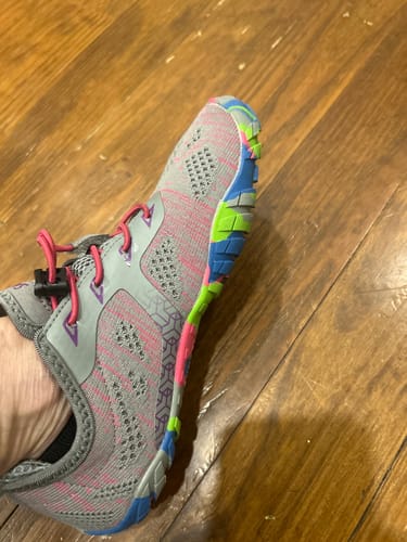 Customer's angled view of the Smart II Barefoot Shoe on foot, showing the grey/pink knit design and colorful sole.