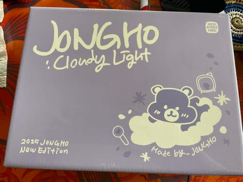Customer's packaging for the ATEEZ - JONGHO : CLOUDY LIGHT, a purple box with a cute bear graphic.